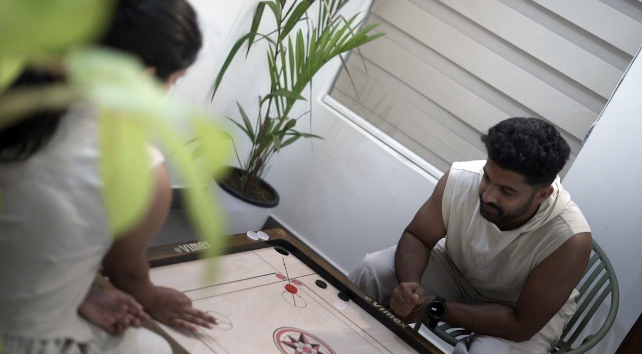 Guests playing carrom on the veranda