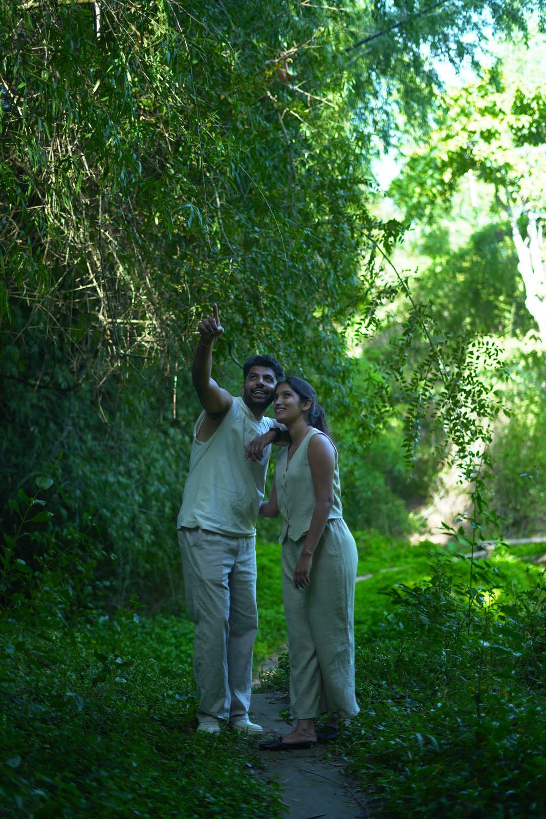 Guests on a guided nature walk along a green forest trail on the property